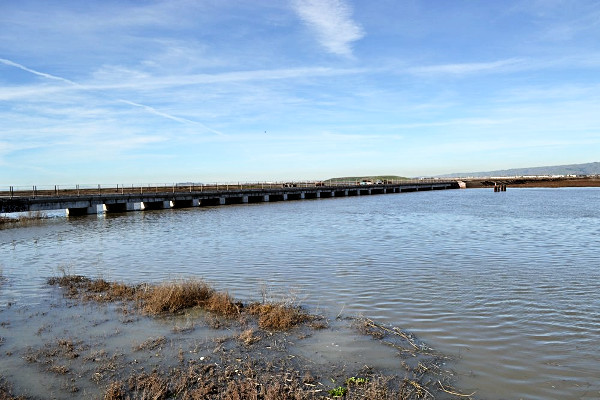 Drawbridge as viewed from the vista point across Coyote Creek, with the railway track to the left.